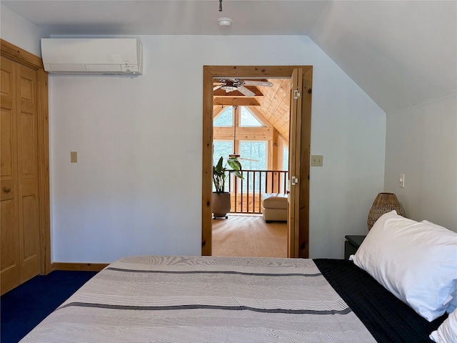 carpeted bedroom with a wall mounted air conditioner and vaulted ceiling