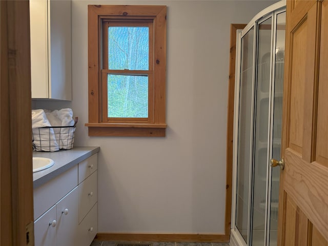 bathroom featuring vanity and walk in shower