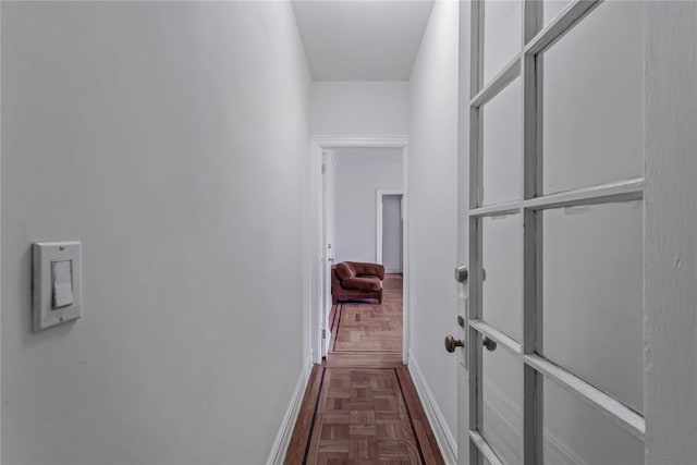 corridor featuring dark parquet floors