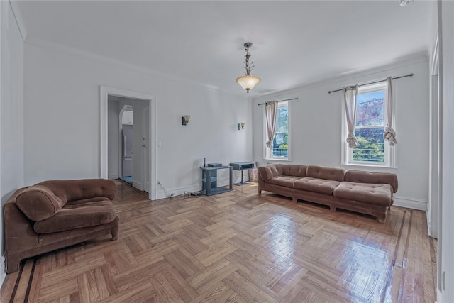 living room with crown molding and light parquet flooring