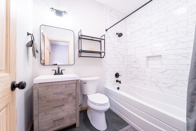 full bathroom featuring toilet, tile patterned floors, vanity, and tiled shower / bath combo