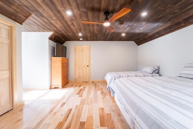 unfurnished bedroom featuring ceiling fan, light wood-type flooring, wood ceiling, and vaulted ceiling