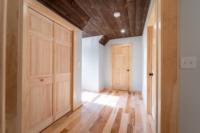 hallway featuring wooden ceiling and light hardwood / wood-style floors