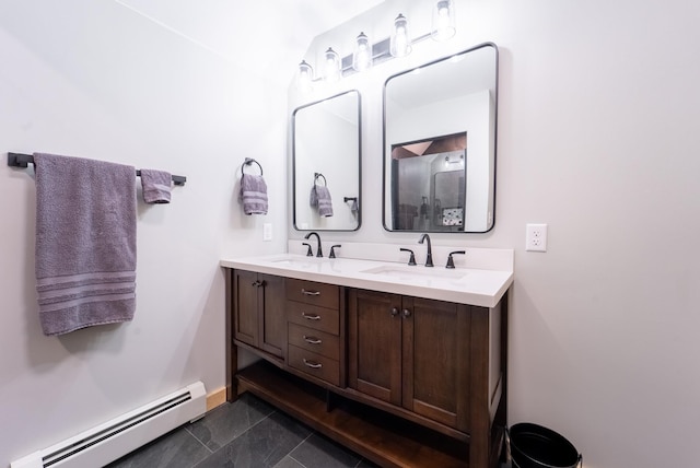 bathroom with vanity, a baseboard radiator, and tile patterned floors