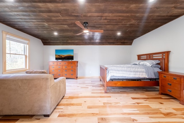 bedroom featuring ceiling fan, light hardwood / wood-style floors, wood ceiling, and vaulted ceiling