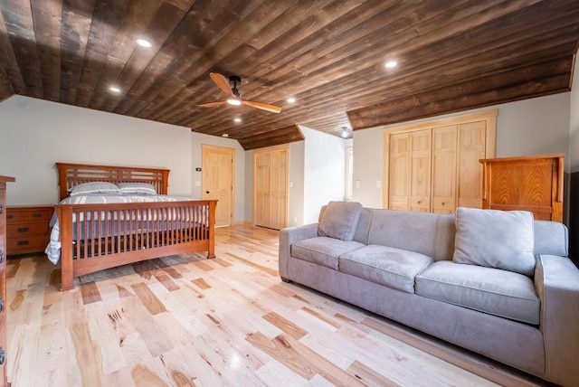 bedroom featuring ceiling fan, light hardwood / wood-style flooring, wood ceiling, and lofted ceiling