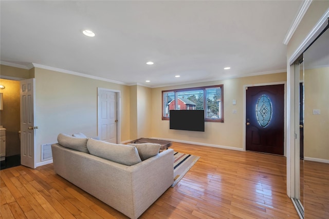 living room featuring light hardwood / wood-style floors and crown molding