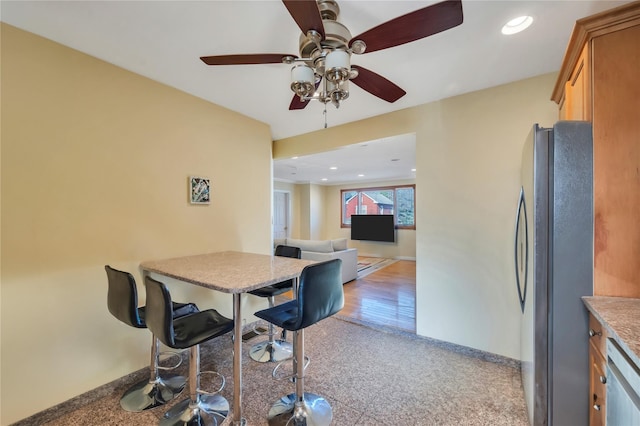 dining space featuring ceiling fan