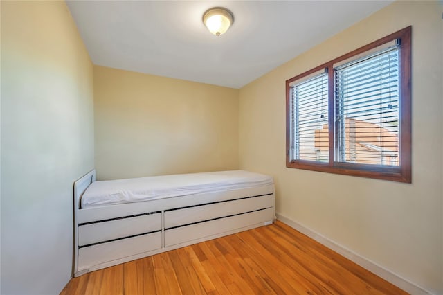 unfurnished bedroom featuring light wood-type flooring