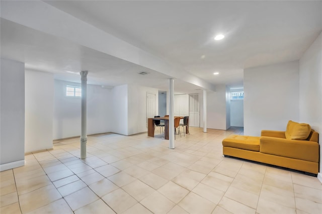 basement featuring light tile patterned flooring