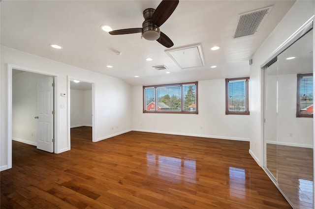 empty room featuring ceiling fan and dark wood-type flooring