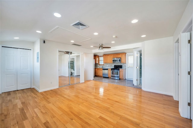 unfurnished living room with light hardwood / wood-style floors and ceiling fan