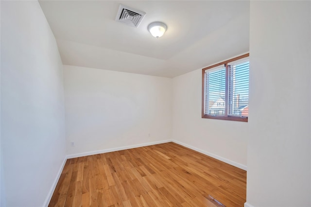 spare room featuring light hardwood / wood-style flooring