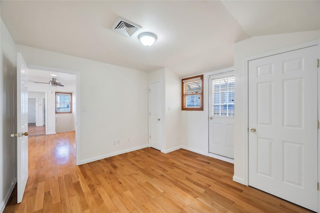 interior space featuring a healthy amount of sunlight, ceiling fan, and light hardwood / wood-style flooring