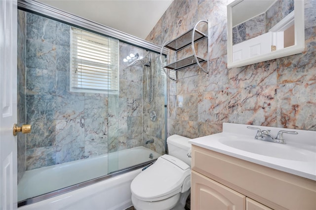 full bathroom featuring toilet, enclosed tub / shower combo, and vanity