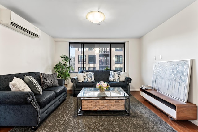 living room with a wall mounted AC and dark hardwood / wood-style flooring