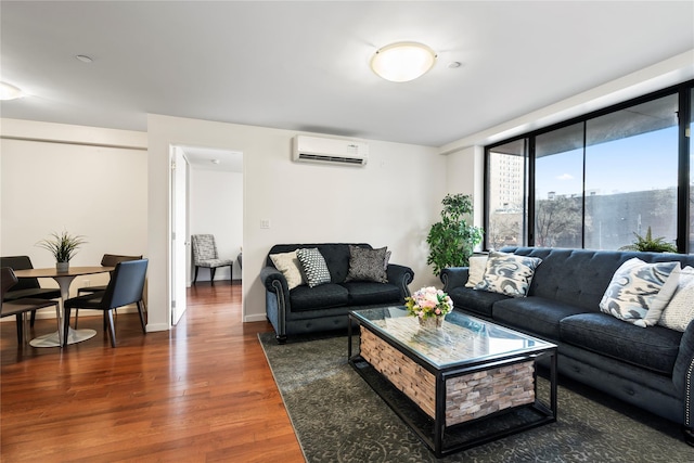 living room featuring dark hardwood / wood-style floors and a wall mounted AC