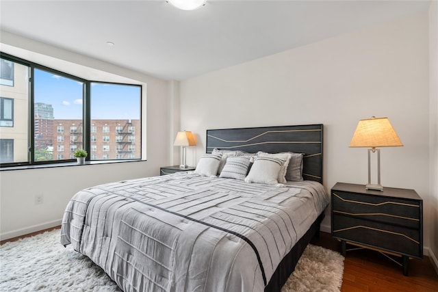 bedroom with wood-type flooring