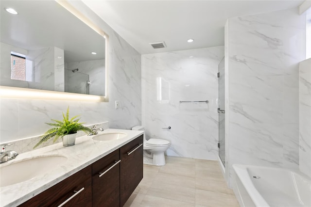 full bathroom featuring vanity, shower with separate bathtub, toilet, and tile walls