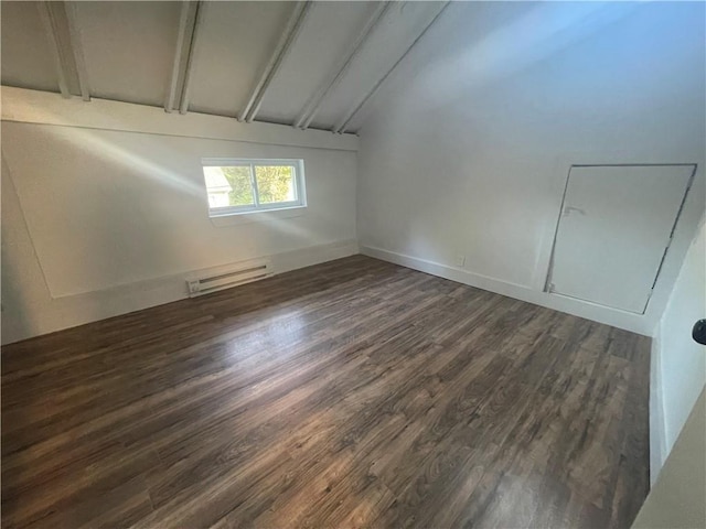 unfurnished room featuring vaulted ceiling with beams, dark hardwood / wood-style flooring, and a baseboard heating unit