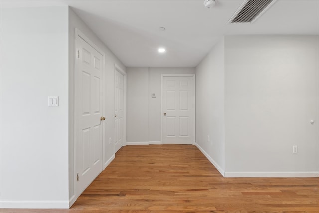 corridor featuring light hardwood / wood-style flooring