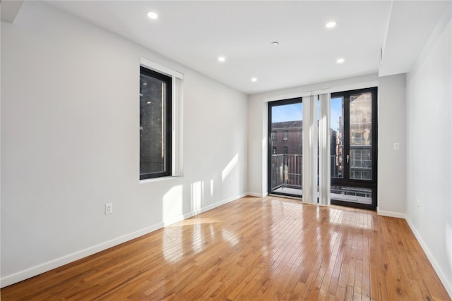 unfurnished room featuring light wood-type flooring