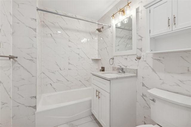 full bathroom with toilet, tiled shower / bath, tile walls, and vanity