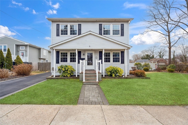 view of property featuring a front yard