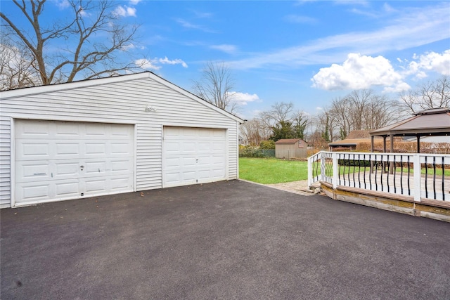 garage featuring a yard