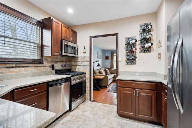 kitchen featuring light tile patterned floors and appliances with stainless steel finishes