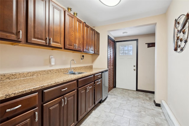 kitchen with a baseboard heating unit, dishwasher, and sink