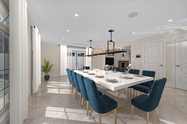 dining area featuring a textured ceiling and an inviting chandelier