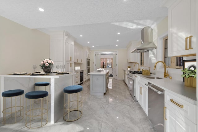 kitchen featuring a center island, white cabinetry, and island exhaust hood