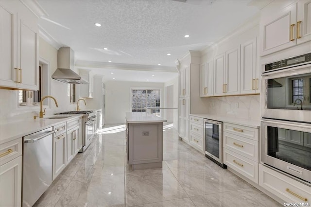 kitchen featuring white cabinets, sink, stainless steel appliances, and island range hood