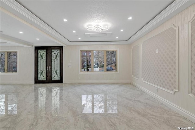 foyer featuring crown molding and french doors