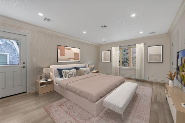 bedroom with multiple windows, crown molding, and light hardwood / wood-style flooring