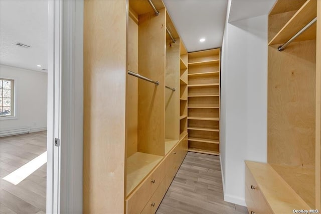 walk in closet featuring light wood-type flooring