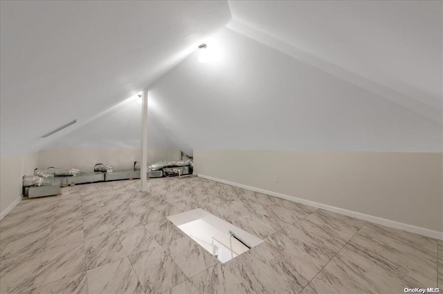 additional living space with vaulted ceiling