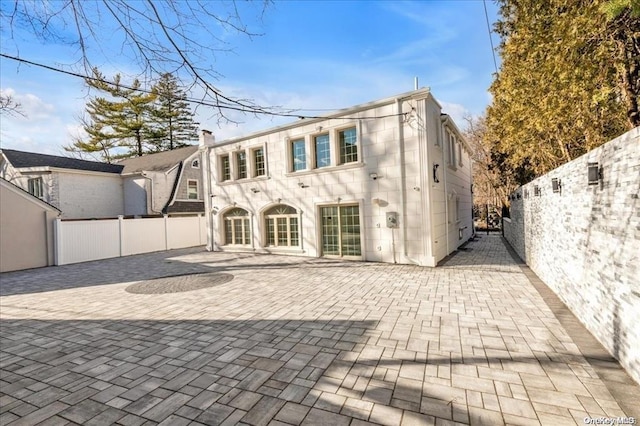 rear view of property featuring a patio area