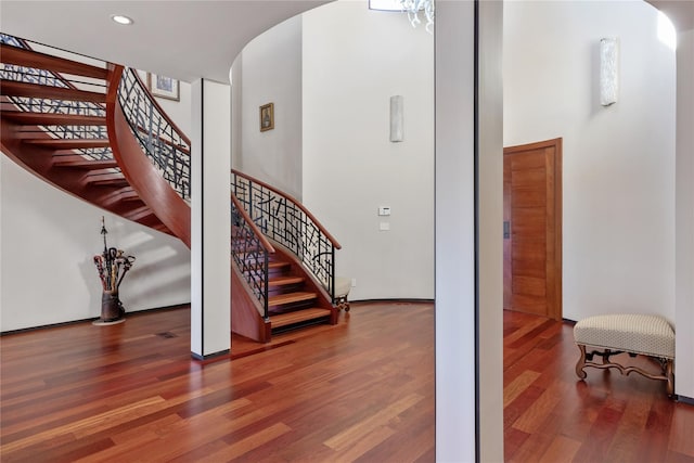 stairs with hardwood / wood-style floors