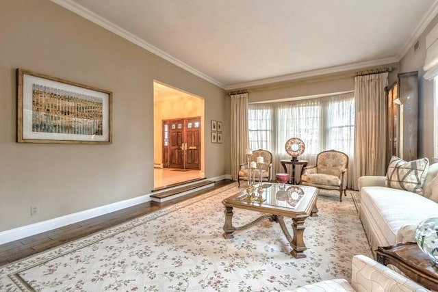 living room with hardwood / wood-style flooring and crown molding