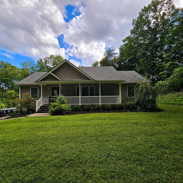 view of front facade with a front yard and a porch