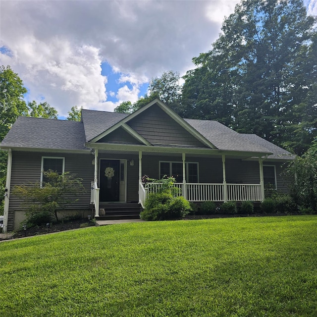 view of front facade with covered porch and a front lawn