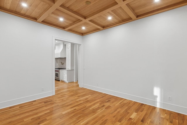 spare room featuring wood ceiling, coffered ceiling, light hardwood / wood-style floors, and beam ceiling