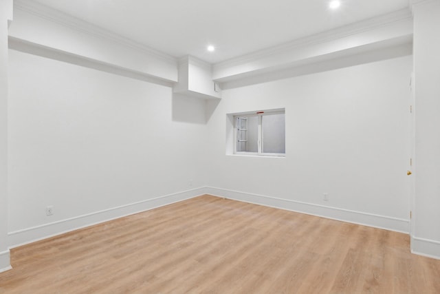 interior space with ornamental molding and light hardwood / wood-style flooring