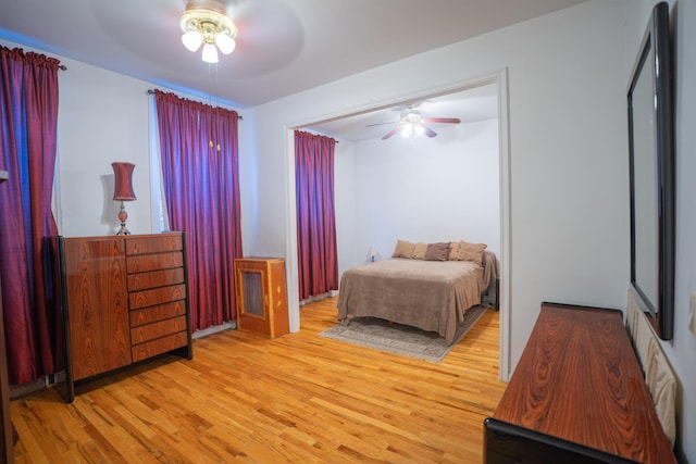 bedroom featuring ceiling fan and light hardwood / wood-style floors