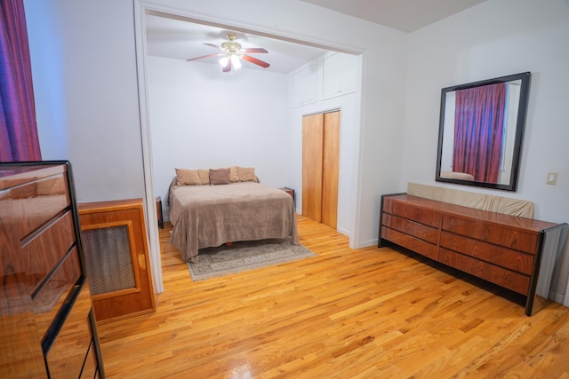 bedroom with ceiling fan and light hardwood / wood-style flooring