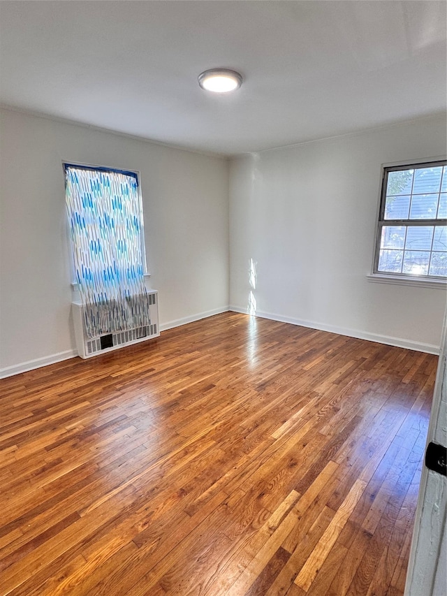 unfurnished living room with hardwood / wood-style floors