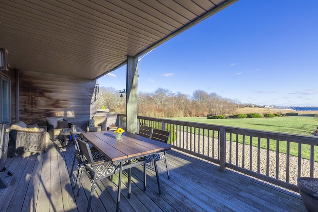 wooden deck with a yard