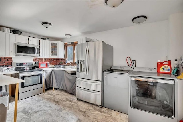 24 Wagner St, Call Listing Agent, NY 13339 - kitchen featuring appliances with stainless steel finishes, light countertops, white cabinetry, backsplash, and a sink